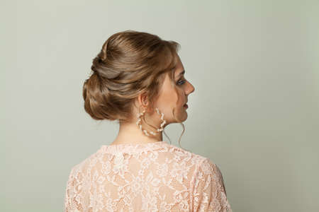 Beautiful female hair and profile. Wedding hairstyle on white backgroundの写真素材