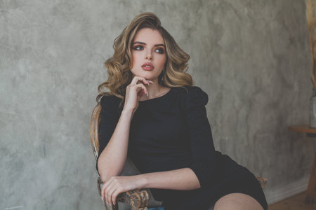 Attractive young woman dreaming, portraitの写真素材