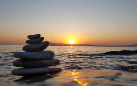 Spa stones balance on sea beach