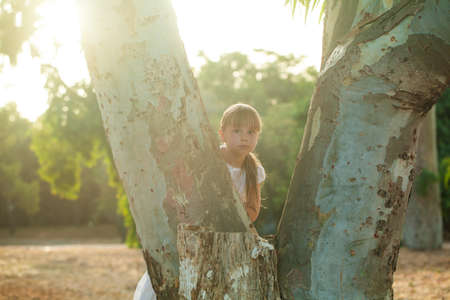 Happy small girl child playing in the parkの写真素材
