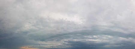 Gray cloudy sky background. Soft clouds skyline