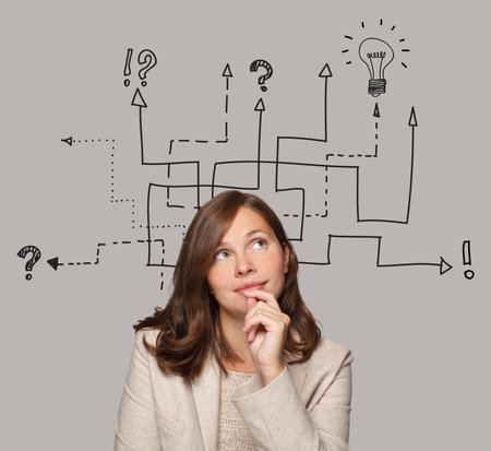 Pensive brunette woman and labyrinth above her head. Idea, brainstorming, thinking conceptの写真素材