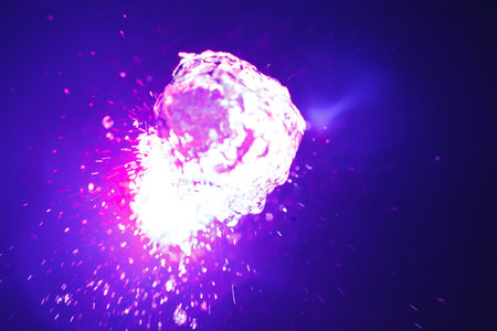 Purple ligth water splash on black background