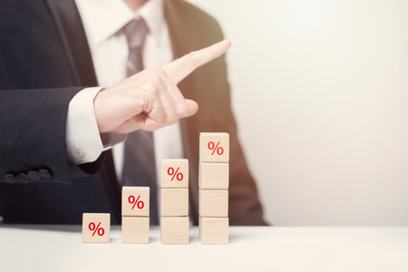 Wooden cubes with percentage, increasing tax conceptの写真素材