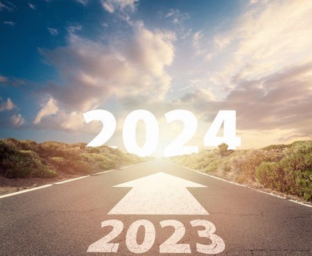 Road and New year 2024 concept. Driving on an empty road to Goals 2024.の写真素材