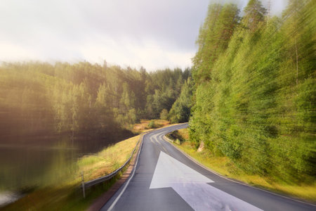 Movement and drive concept, landscape with road and arrowの写真素材