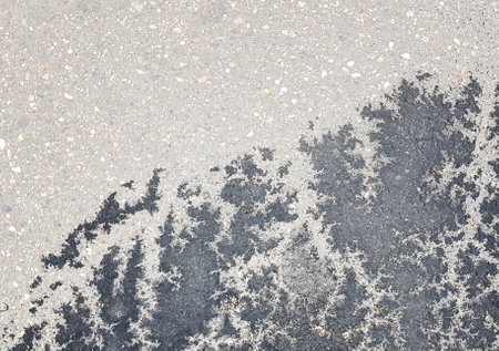 Black and gray cement plaster stucco background with painted patternの写真素材