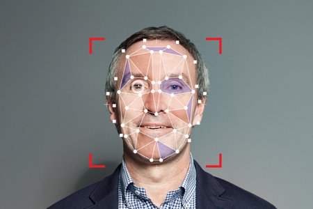 Facial recognition of senior businessman. Mature man with technology biometric security systemの写真素材