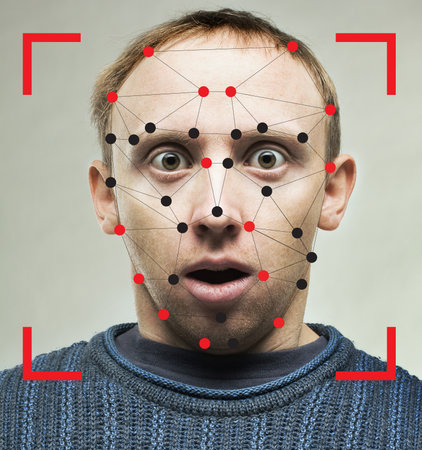 Shocked man with technology biometric security system. Facial recognition conceptの写真素材