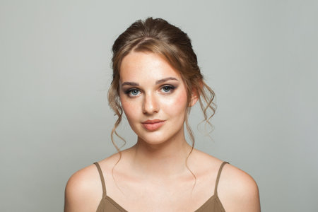Glorious fashionable model woman with natural make-up, healthy fresh skin and beautiful hairstyle,...