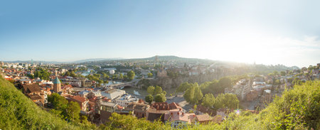 Beautiful sunny landscape of Tbilisi and green mountainsの写真素材