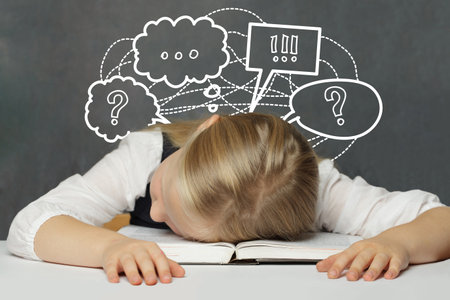child girl with thought cloud bubble above head on white backgroundの写真素材
