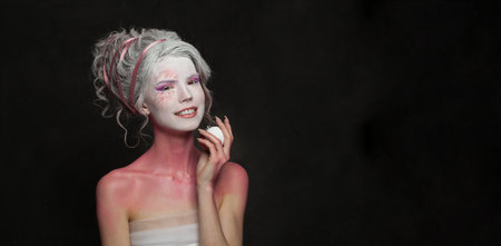 Charming beautiful woman in carnival Halloween costume, theater actress