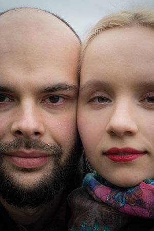Close-up face of couple. Man and woman in love, outdoors lifestyle portrait