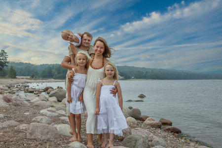 Happy family outdoors portrait. Father, mother and children.の写真素材