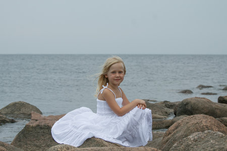 Cheerful little girl outdoors portraitの写真素材