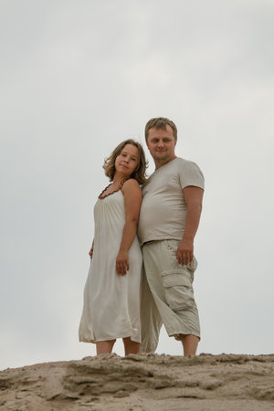 Cheerful couple. Wife and husband outdoors portraitの写真素材