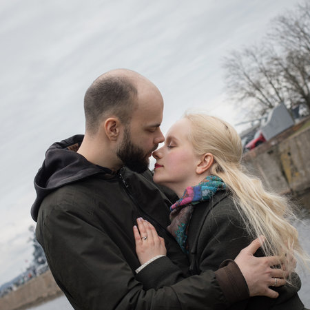 Young adult woman with blond hair and handsome man outdoors. Happy coupleの写真素材