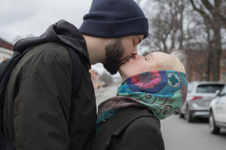 Lovely young couple expressing their feelings on the streetの写真素材