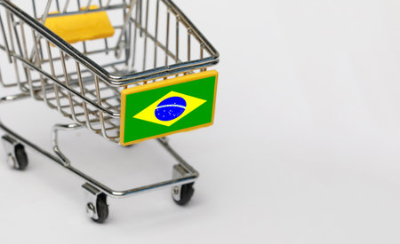 Shopping, VAT and retail in Brazil concept. Shopping Cart with Brazilian flag on white backgroundの写真素材