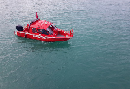 Red emergency boat through the sea, top viewの写真素材