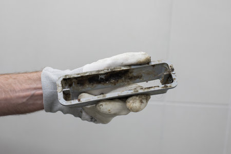 Bathroom drain with mildew and dirt in plumber handの写真素材