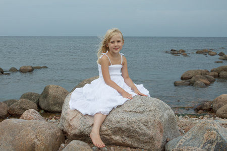 Joyful little girl outdoors portraitの写真素材