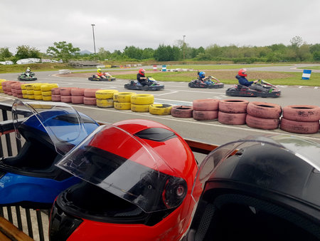 Family Go-Karts outdoors. car helmet in front of raceの写真素材