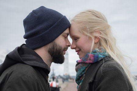 Closeup portrait of young couple. Man and woman in love, outdoors lifestyle portraitの写真素材