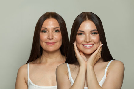 Adorable young model woman and mature woman. Two female faces collage set. Old and young faceの写真素材