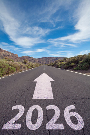 2026 year on asphalt road surface with marking lines. Happy New Year concept