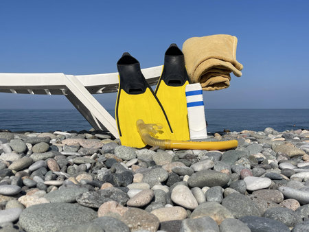 diving  equipment lies on a rock near the beachの写真素材
