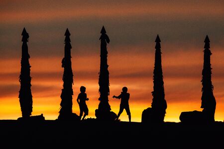 Summer sunrise on lake Baikal landscape with balck silhouetteの写真素材