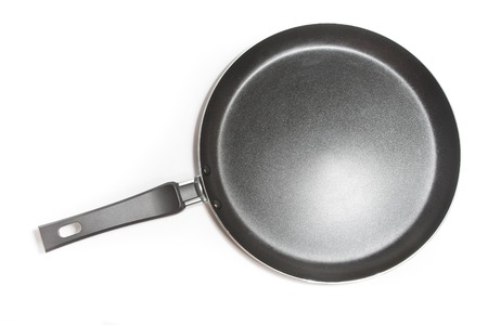 Black frying pan isolated on white background.の写真素材