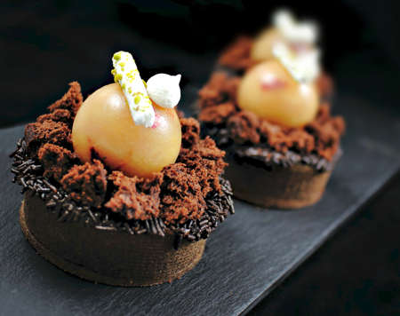 Apple and chocolate tart with brownie and meringuesの写真素材