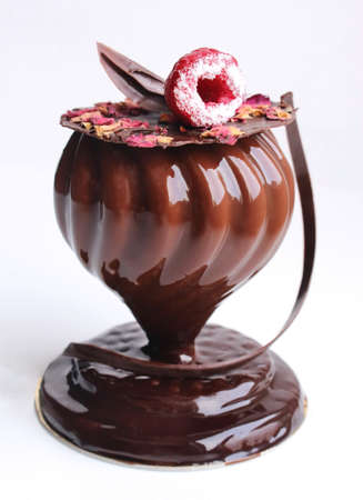 Romantic red and black raspberry cake with pistachio ganache and fresh berriesの写真素材