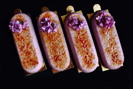 Purple spring Creme Brulee dessert with fresh lilac flowers
