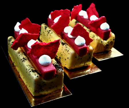 Colorful yellow and red desserts with baked meringues