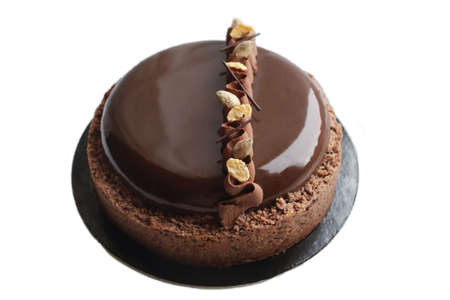 Dark chocolate cake with mirror glaze and crumble borderの写真素材