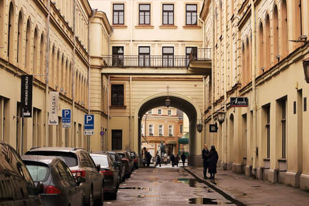 Philarmonic building with big street arch with cars and peopleのeditorial素材