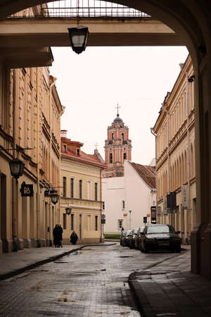 Philarmonic building with big street arch and street light with cars and peopleのeditorial素材