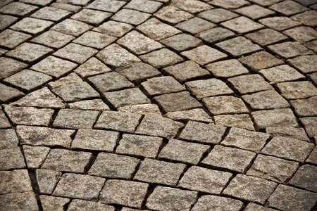 Gray dry old town square road tiles arranged in a fan design