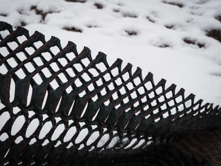 Zigzag plastic wired texture contrasting with white snow