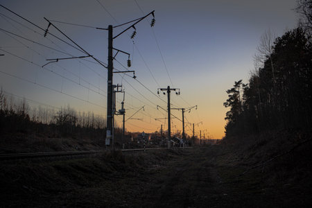 Sunset behind the railway lines the light of the setting sun in springの写真素材