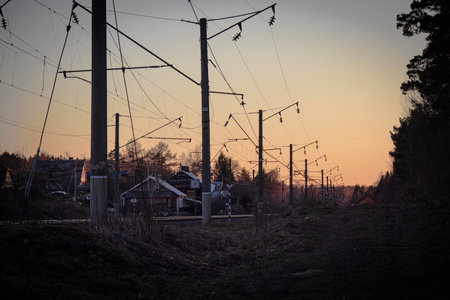 Sunset behind the railway lines the light of the setting sun in springの写真素材