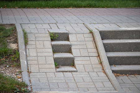The grey bricks stairs case with a space for wheel chair or baby carriageの写真素材