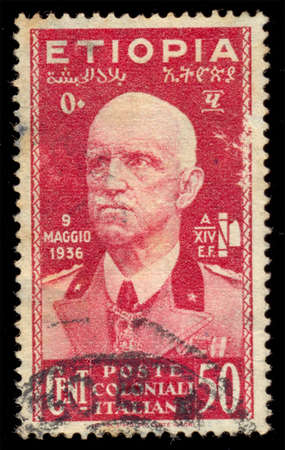 ITALY - CIRCA 1936: A stamp printed in Italy, shows the Emperor Victor Emmanuel III, 9 May, 1936 to commemorate the day that Ethiopia was annexed by Italy. circa 1936のeditorial素材