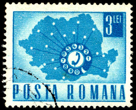 ROMANIA - CIRCA 1967: A stamp printed in Romania shows a Telephone Dial and Map of Romania, circa 1967のeditorial素材