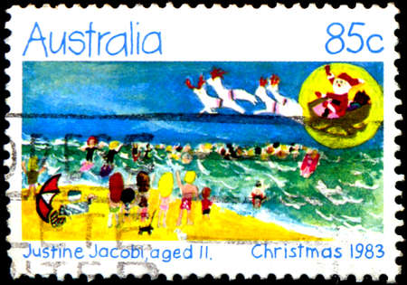 AUSTRALIA - CIRCA 1983: a stamp printed in the Australia shows Holiday Beach Scene, Design by Justine Jacobi, Aged 11, Christmas, circa 1983のeditorial素材