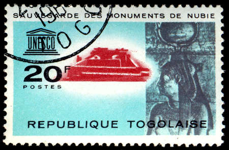 TOGO - CIRCA 1964: A stamp printed in Togo shows the Monuments of Nubia with inscription and name of the series \" Save the Monuments of Nubia\", circa 1964のeditorial素材